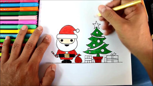 Drawing Santa Claus next to th...